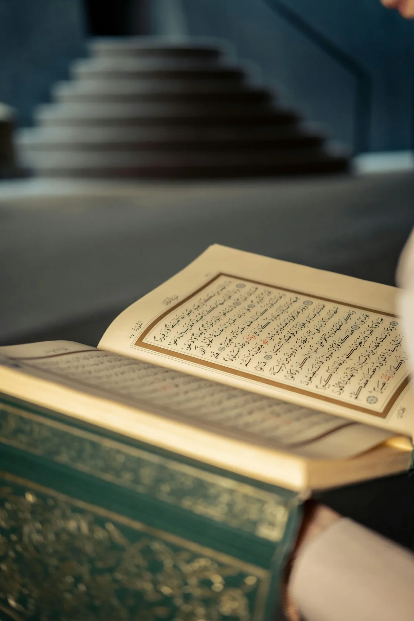 An open Quran with softly lit pages